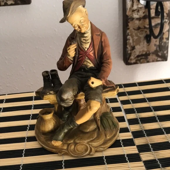 Man sitting on a bench - Picture 2 of 8